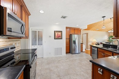 This well-maintained 3-bed, 2-bath CBS pool home sits on one of - photo 22