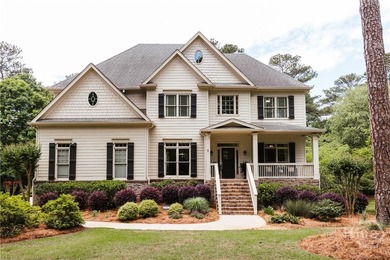 Set on a generous .68-acre lot with access to 15 acres of green - photo 2