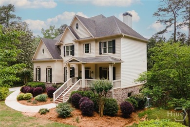 Set on a generous .68-acre lot with access to 15 acres of green - photo 3