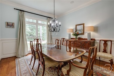 Set on a generous .68-acre lot with access to 15 acres of green - photo 9