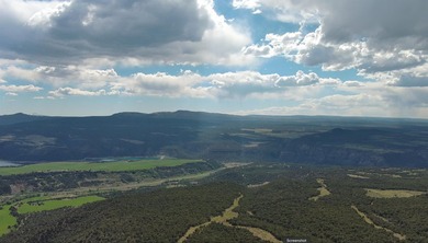 Perched over the breathtaking Uncompahgre Valley, and peering - photo 7