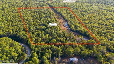 Heavily wooded 5.54 acre lot near military cutoff and I 140 - photo 8