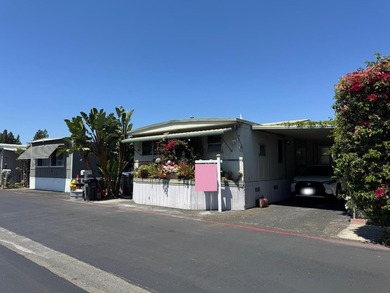 A spacious 2-bedroom, 2-bath mobile home located in the - photo 1