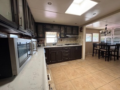 A spacious 2-bedroom, 2-bath mobile home located in the - photo 9
