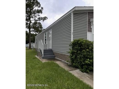 Like-new 2022 2-bedroom, 1-bath mobile home offering modern - photo 1
