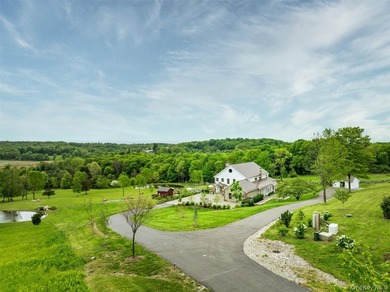 Welcome to Sunset Ridge Farm. A discreet tree-lined drive with - photo 5