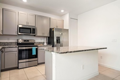 Welcome to this charming 4-bedroom, 3.5-bathroom townhouse in - photo 9