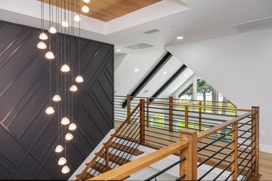 This modern farmhouse mini mansion on the water is truly a - photo 18
