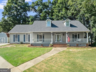 Lake Home For Sale in Flowery Branch, Georgia