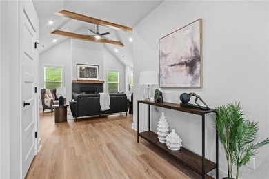 Soaring vaulted ceilings with wood beams, gas log fireplace & - photo 6