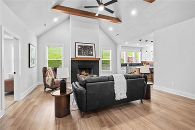 Soaring vaulted ceilings with wood beams, gas log fireplace & - photo 7