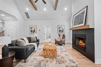 Soaring vaulted ceilings with wood beams, gas log fireplace & - photo 10