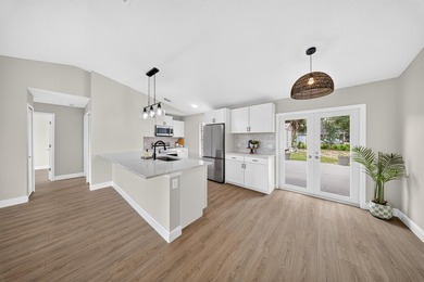 Welcome home to this beautifully updated modern residence where - photo 8