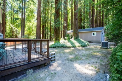 Nestled beneath a canopy of majestic redwood trees on a spacious - photo 34