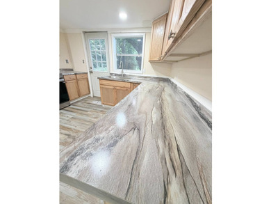 Discover the perfect starter home or weekend getaway in this - photo 18