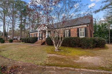 Welcome to this beautifully maintained traditional brick ranch