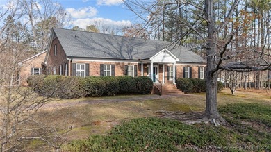 Welcome to this beautifully maintained traditional brick ranch
