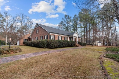 Welcome to this beautifully maintained traditional brick ranch