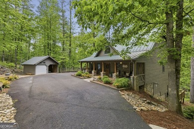 Tucked away in the woods of Sautee Nacoochee, this exceptionally - photo 2