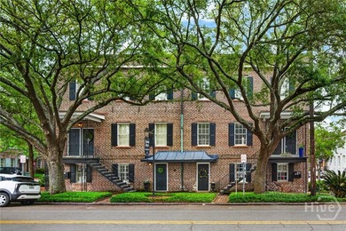 Perched above one of Savannah's most picturesque streets, this - photo 1