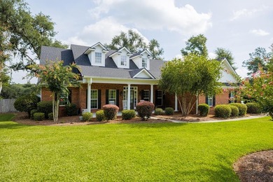 Located on a quiet cul-de-sac in the desirable Cypress Lakes