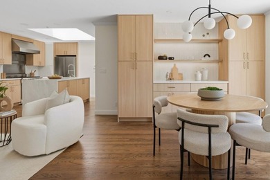 Situated on a picturesque tree-lined street and located down a - photo 3