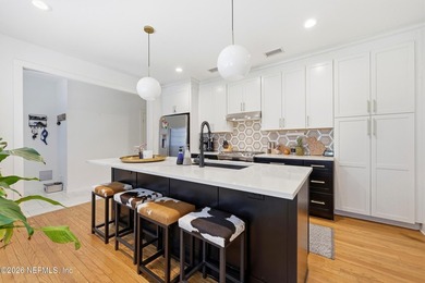 Rare opportunity to own a beautifully renovated duplex in the - photo 9