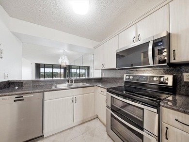 Enjoy beautiful water views and total peace of mind from this - photo 6