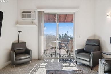 Top-floor, end-unit condo offering added privacy, natural light