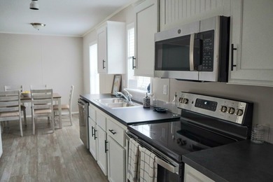 This Brand New Model Home is A Must-See and includes 6 Months - photo 7