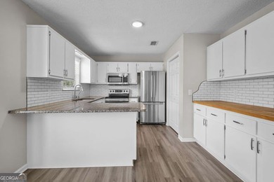 A beautifully updated 3 bedroom, 2 bath home located in the - photo 10