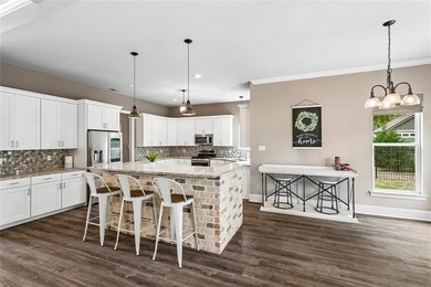 Situated in The Landings subdivision, this all-brick - photo 5