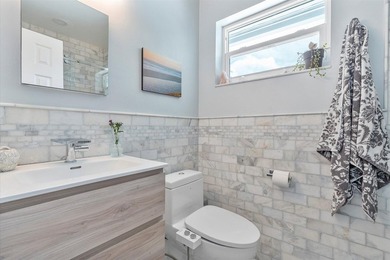 Welcome to this charming 4-bedroom 2-bath home situated in the - photo 26