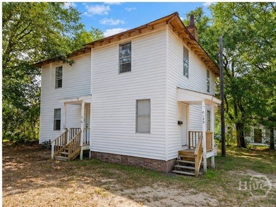 Solid duplex opportunity on a spacious corner lot with real - photo 1