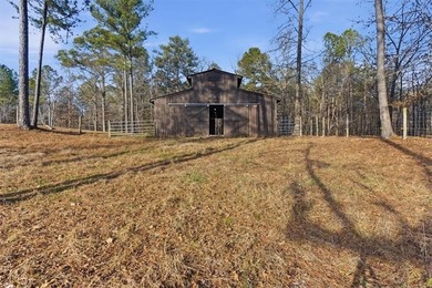 Behind a gated entrance, a private drive opens to five acres of - photo 16
