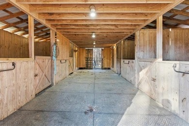 Behind a gated entrance, a private drive opens to five acres of - photo 17