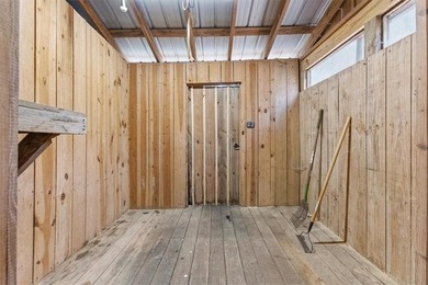 Behind a gated entrance, a private drive opens to five acres of - photo 18