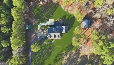 Behind a gated entrance, a private drive opens to five acres of - photo 31