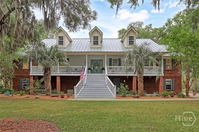 Gracefully set along sweeping marsh-front vistas, this - photo 3