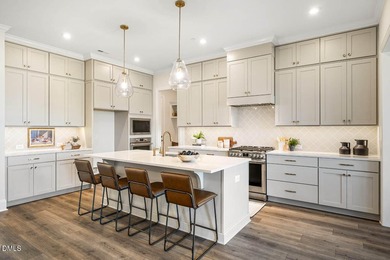 MOVE-IN READY! This beautifully designed executive townhome is - photo 2
