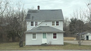 This colonial-style home features three bedrooms, two full baths - photo 1