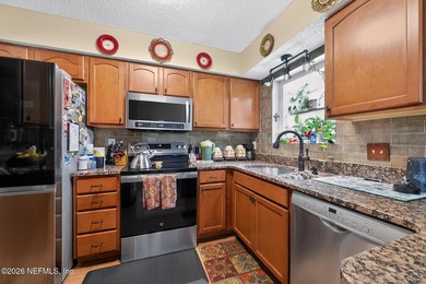 Welcome home to this beautifully maintained property featuring a - photo 9