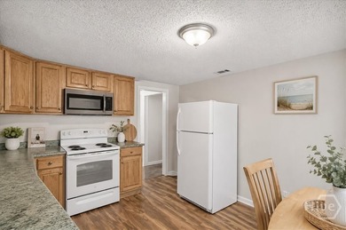 This all brick 3-bedroom, 1-bath all-brick home presents an - photo 8