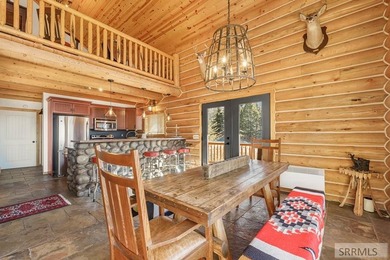 Perched on a half-acre of pristine land, this full-log retreat - photo 11