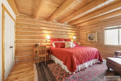 Perched on a half-acre of pristine land, this full-log retreat - photo 13