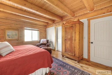 Perched on a half-acre of pristine land, this full-log retreat - photo 14
