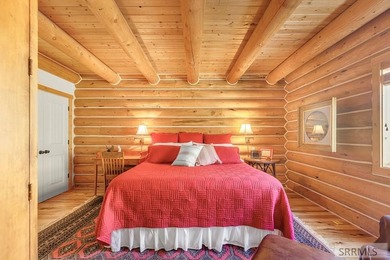 Perched on a half-acre of pristine land, this full-log retreat - photo 15