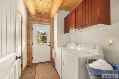 Perched on a half-acre of pristine land, this full-log retreat - photo 20