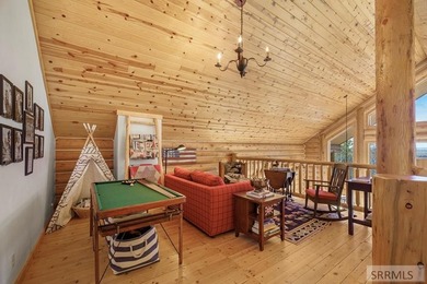 Perched on a half-acre of pristine land, this full-log retreat - photo 21