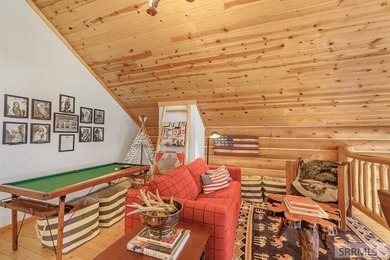 Perched on a half-acre of pristine land, this full-log retreat - photo 22